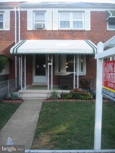 426 Stemmers Run Road Baltimore, MD 21221 - Photo 21 of 21 a view of a brick building with a yard and plants
