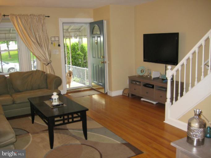 426 Stemmers Run Road Baltimore, MD 21221 - Photo 4 of 21 a living room with furniture and a flat screen tv