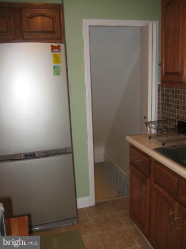 426 Stemmers Run Road Baltimore, MD 21221 - Photo 5 of 21 a bathroom with a sink and a mirror