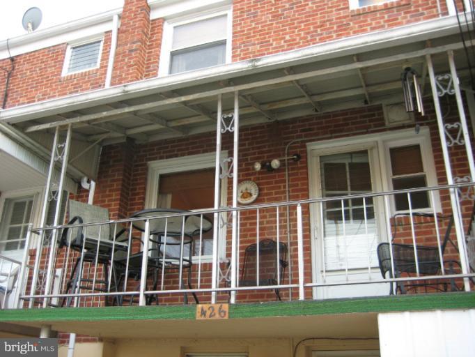 426 Stemmers Run Road Baltimore, MD 21221 - Photo 10 of 21 a view of a brick building with large windows