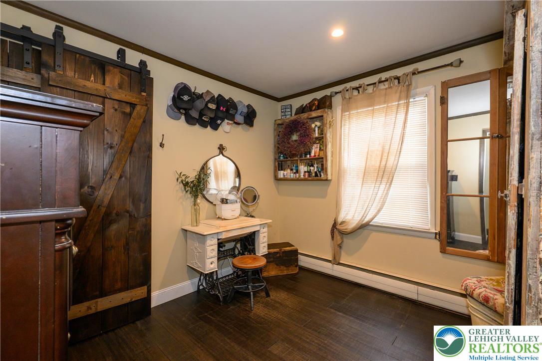 68 Mitchell Avenue Nazareth, PA 18064 - Photo 11 of 45 a view of a hallway with wooden floor and windows with curtains