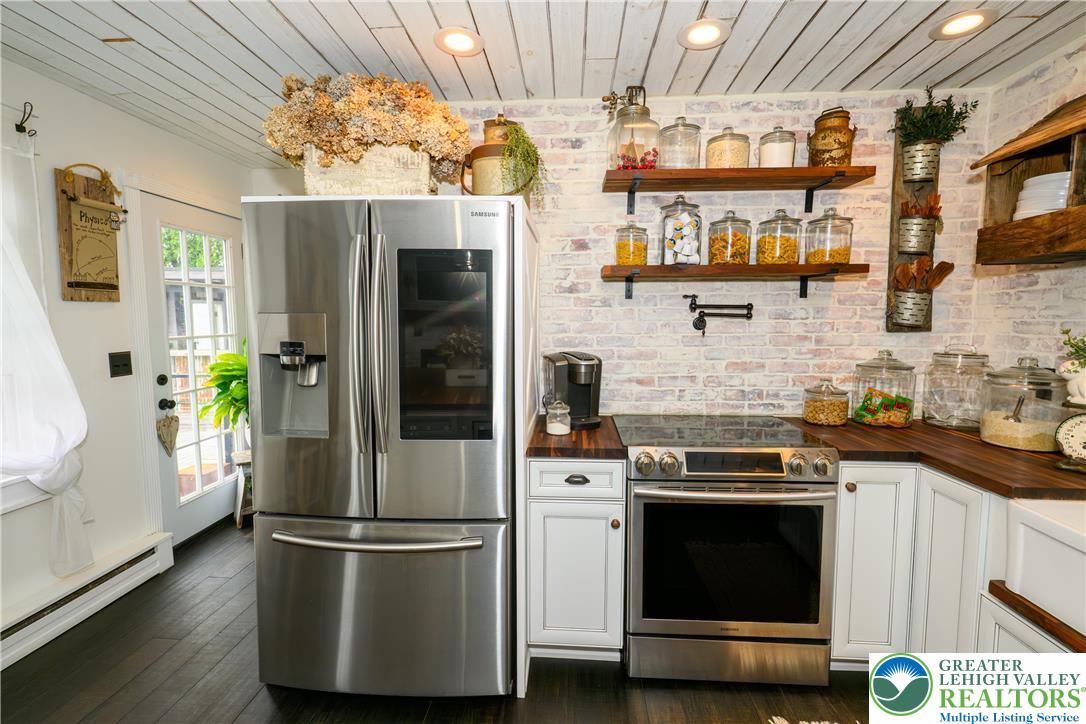 68 Mitchell Avenue Nazareth, PA 18064 - Photo 13 of 45 a kitchen with stainless steel appliances a stove a refrigerator and a sink