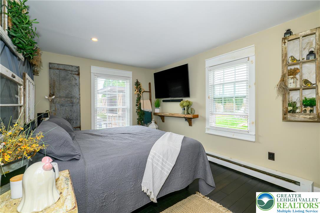 68 Mitchell Avenue Nazareth, PA 18064 - Photo 8 of 45 a bedroom with a bed window television and a window