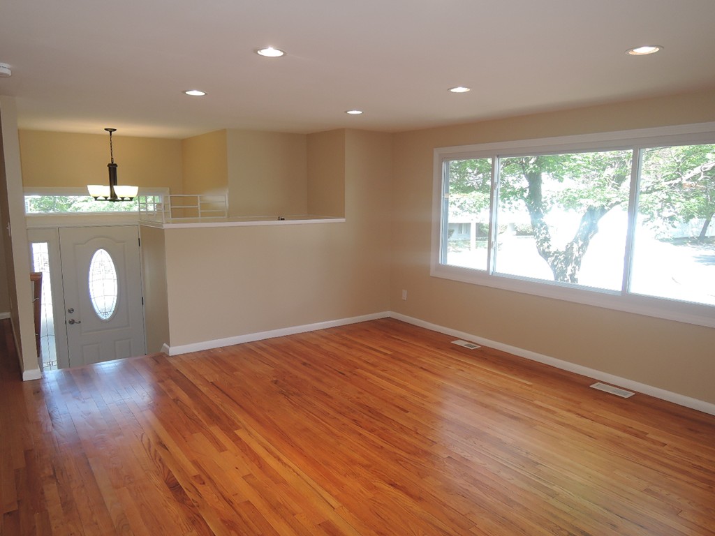 19 Dietz Road Boston, MA 02136 - Photo 4 of 15 a view of an empty room with wooden floor and a window