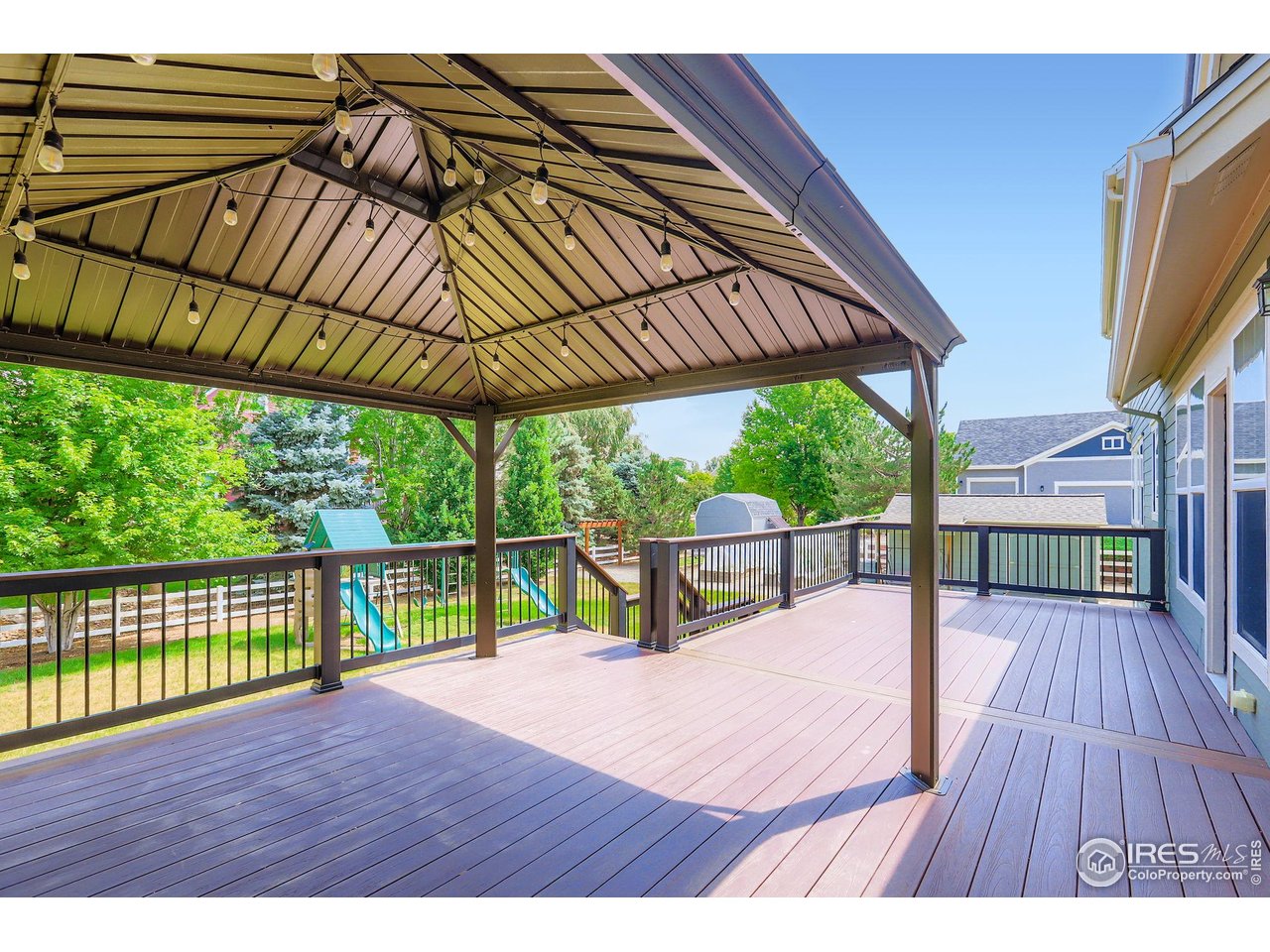 3525 Rinn Valley Drive Longmont, CO 80504 - Photo 11 of 44 huge deck with pergola