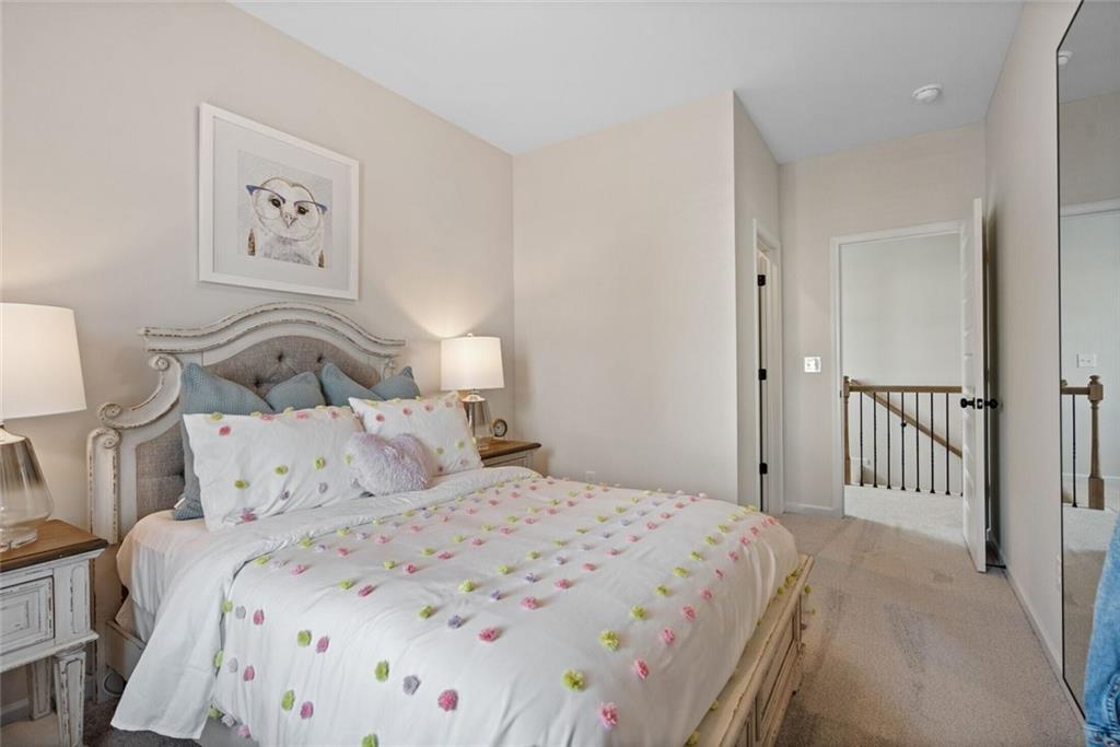 629 Mountaintop Road Southwest Cartersville, GA 30120 - Photo 43 of 46 a bedroom with a bed and a lamp on the dresser