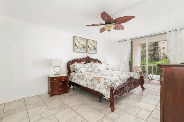 a spacious bedroom with a bed and window
