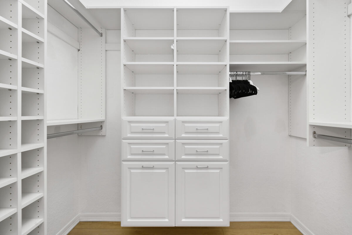193 Porgee Rock Place Jupiter, FL 33458 - Photo 22 of 76 a view of walk in closet with empty racks