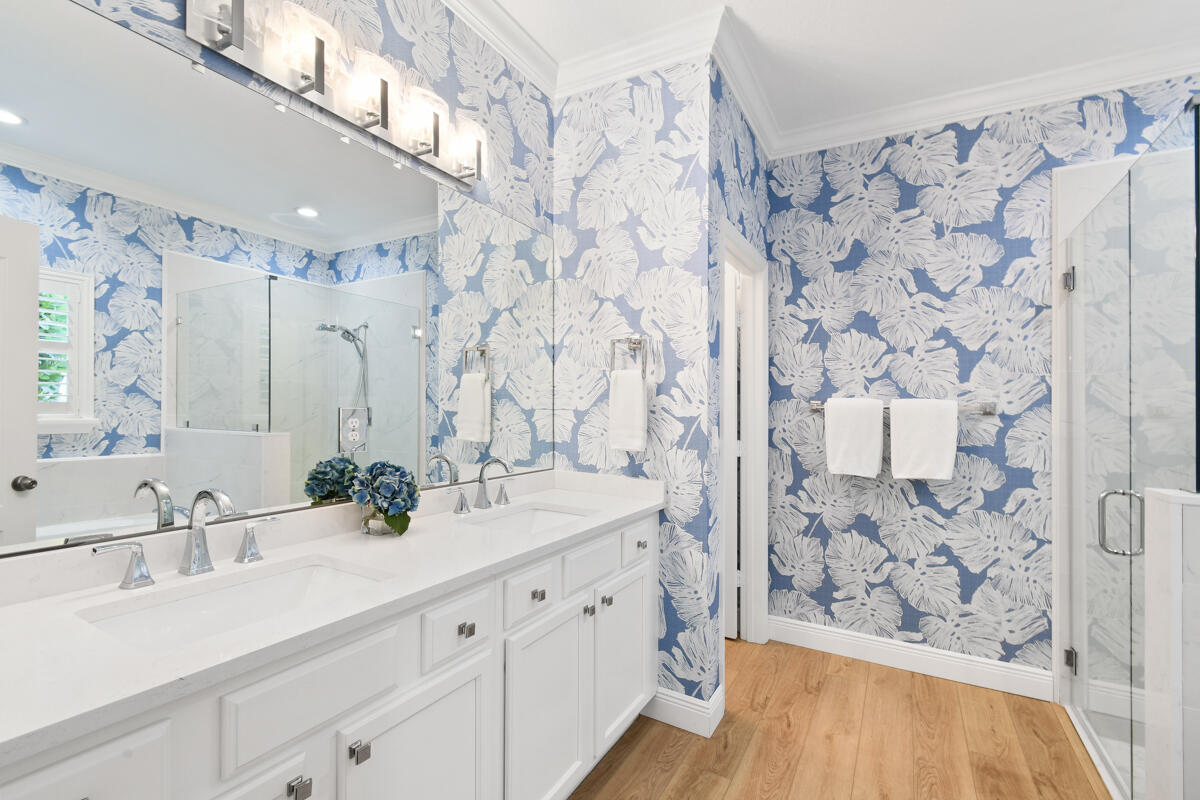 193 Porgee Rock Place Jupiter, FL 33458 - Photo 24 of 76 a bathroom with a sink and a mirror