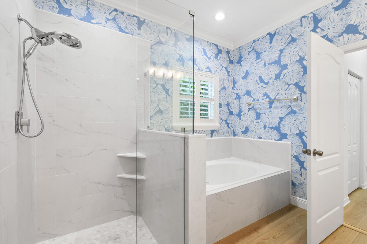 193 Porgee Rock Place Jupiter, FL 33458 - Photo 26 of 76 a bathroom with a bathtub and shower