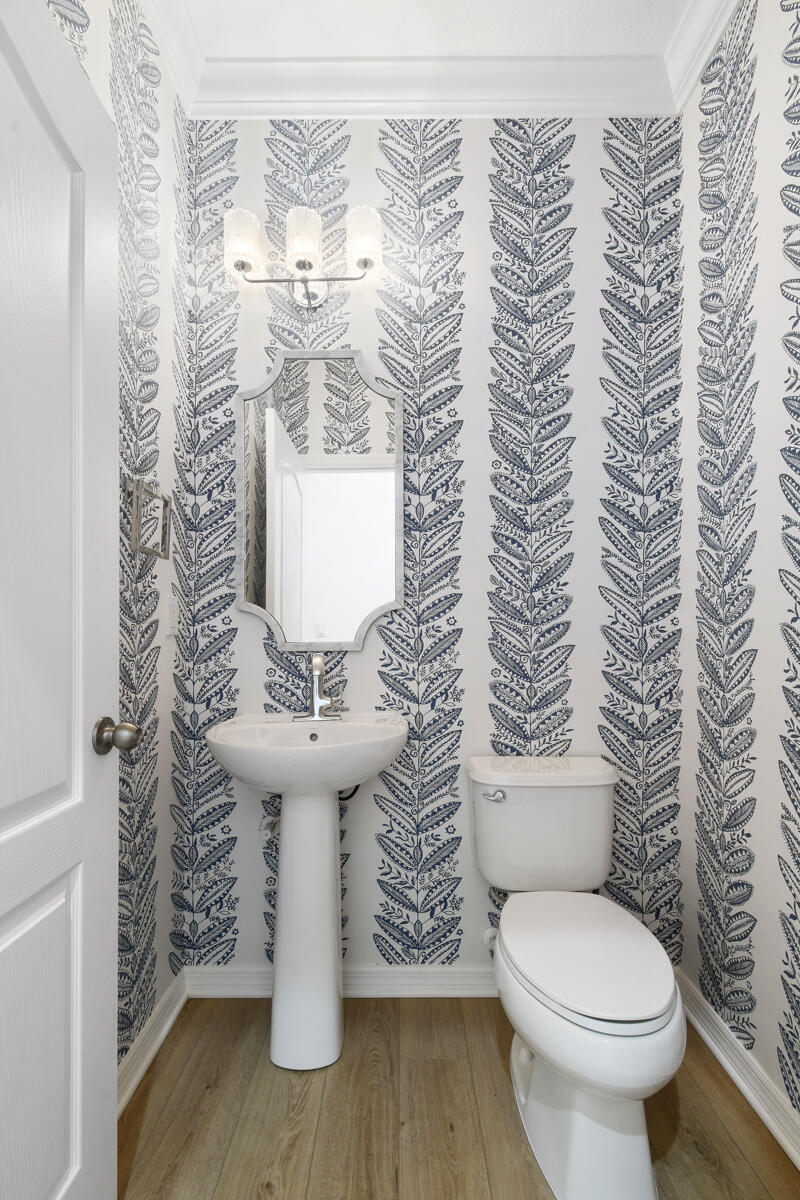 193 Porgee Rock Place Jupiter, FL 33458 - Photo 27 of 76 a bathroom with a toilet and a sink