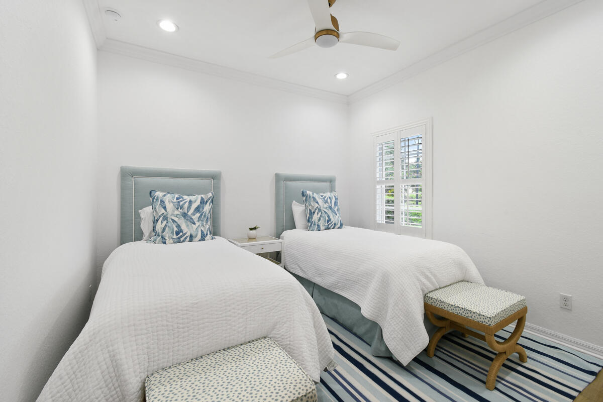 193 Porgee Rock Place Jupiter, FL 33458 - Photo 29 of 76 a bedroom with double bed and a window