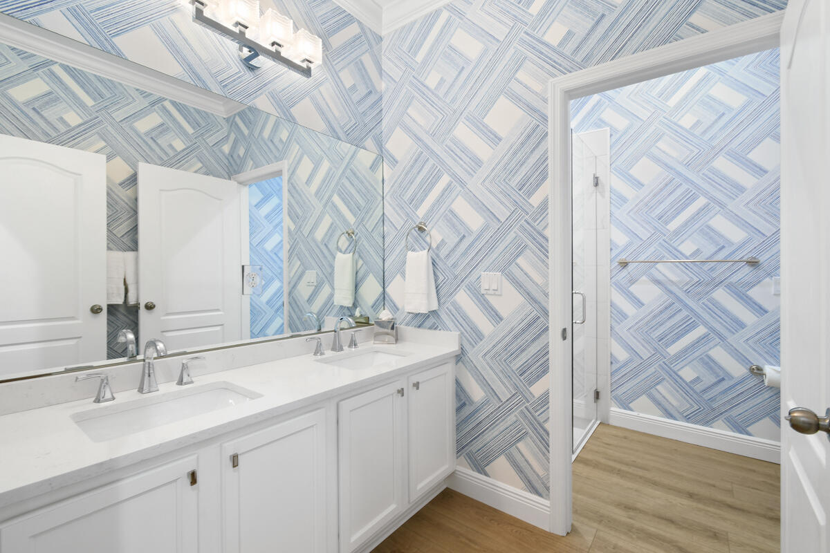 193 Porgee Rock Place Jupiter, FL 33458 - Photo 30 of 76 a bathroom with a sink and a mirror