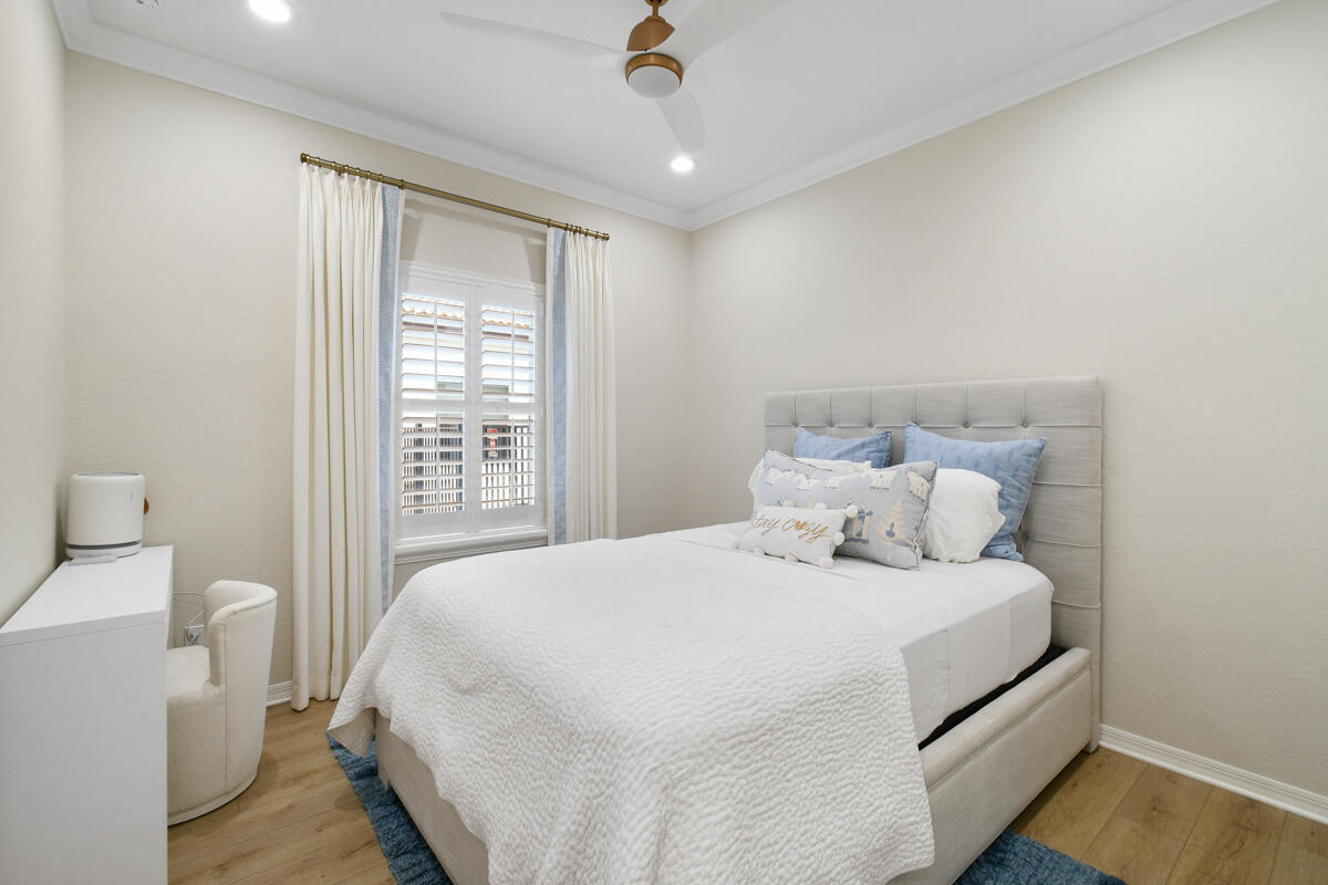 193 Porgee Rock Place Jupiter, FL 33458 - Photo 32 of 76 a bedroom with a bed and a window