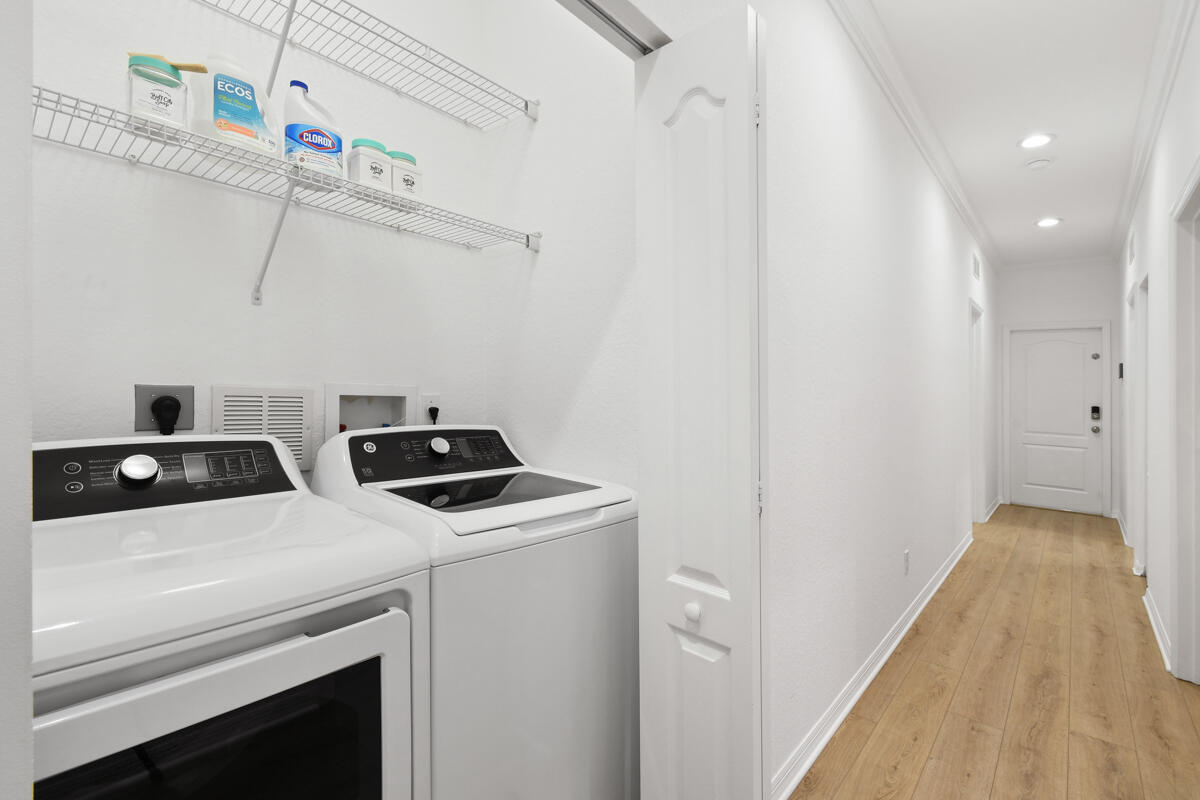 193 Porgee Rock Place Jupiter, FL 33458 - Photo 34 of 76 a view of storage and utility room with racks on the wall