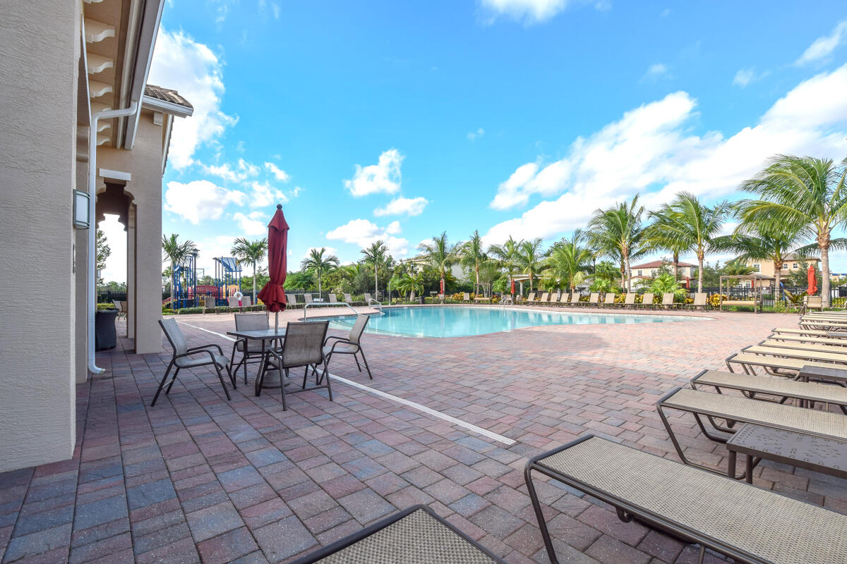 193 Porgee Rock Place Jupiter, FL 33458 - Photo 43 of 76 a view of a patio with a table and chairs