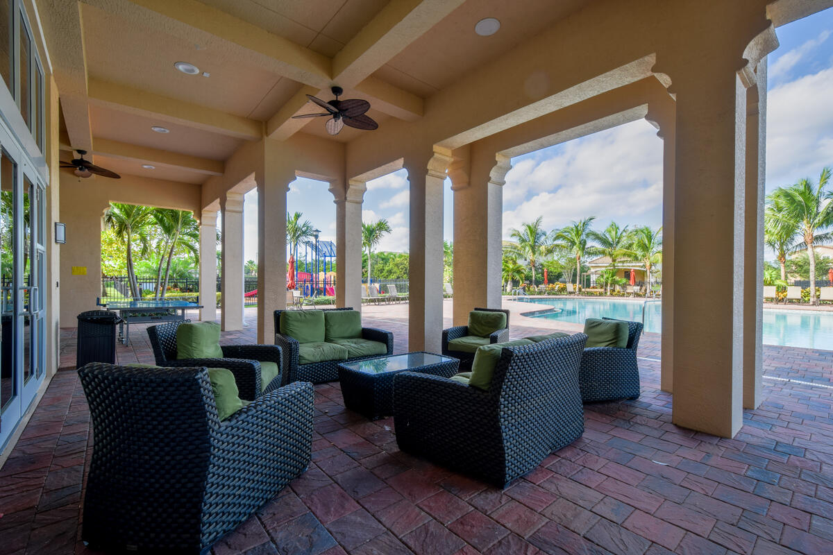 193 Porgee Rock Place Jupiter, FL 33458 - Photo 45 of 76 a living room with furniture and a large window