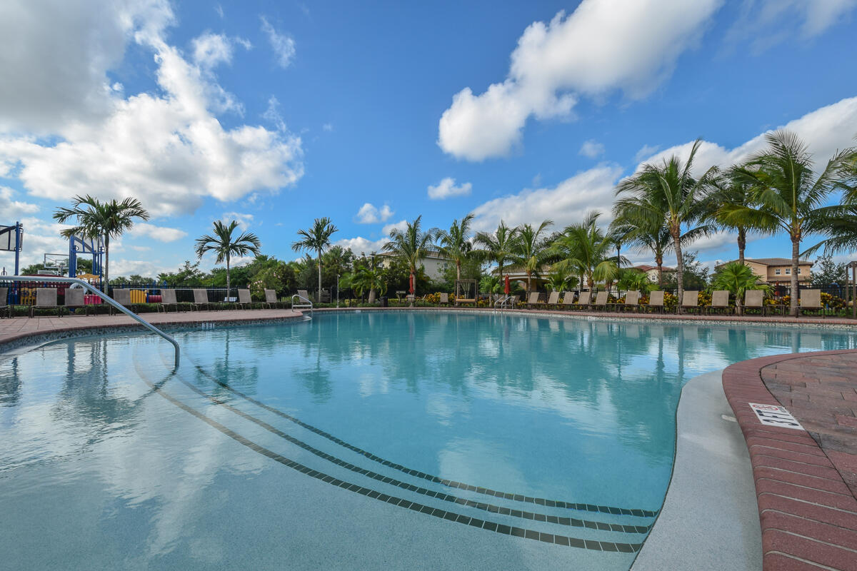 193 Porgee Rock Place Jupiter, FL 33458 - Photo 51 of 76 a view of a lake with boats and trees in the background