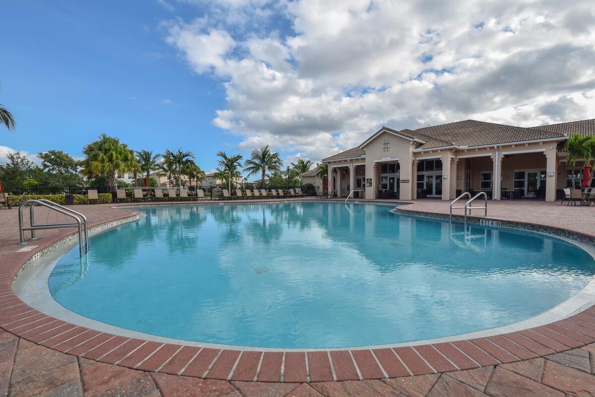 193 Porgee Rock Place Jupiter, FL 33458 - Photo 52 of 76 a view of a swimming pool with a lake view