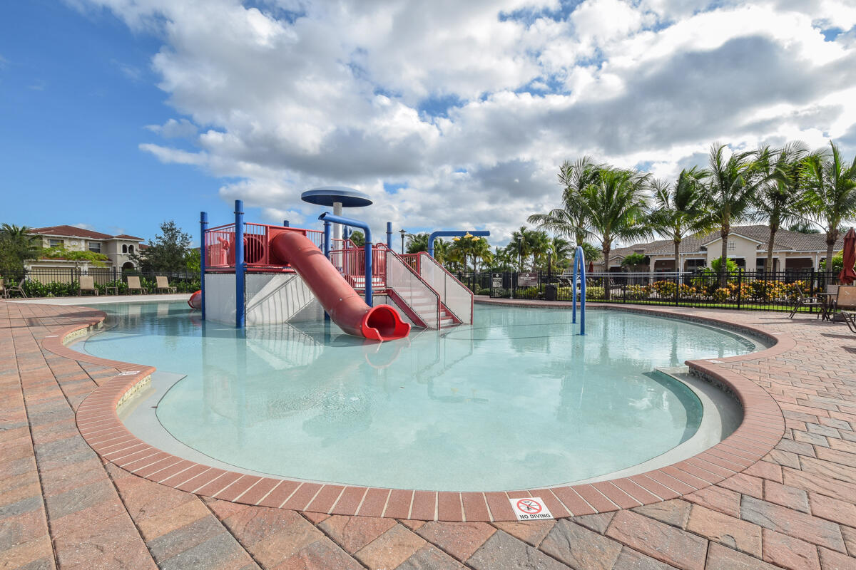 193 Porgee Rock Place Jupiter, FL 33458 - Photo 54 of 76 a view of a swimming pool with a yard