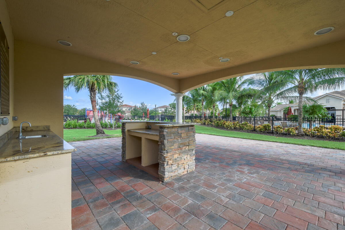 193 Porgee Rock Place Jupiter, FL 33458 - Photo 64 of 76 a view of a patio with a yard