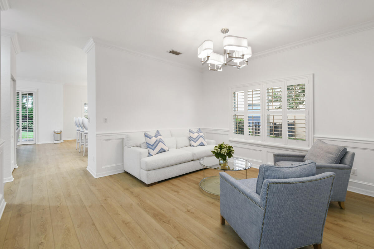 193 Porgee Rock Place Jupiter, FL 33458 - Photo 7 of 76 a living room with furniture and a large window