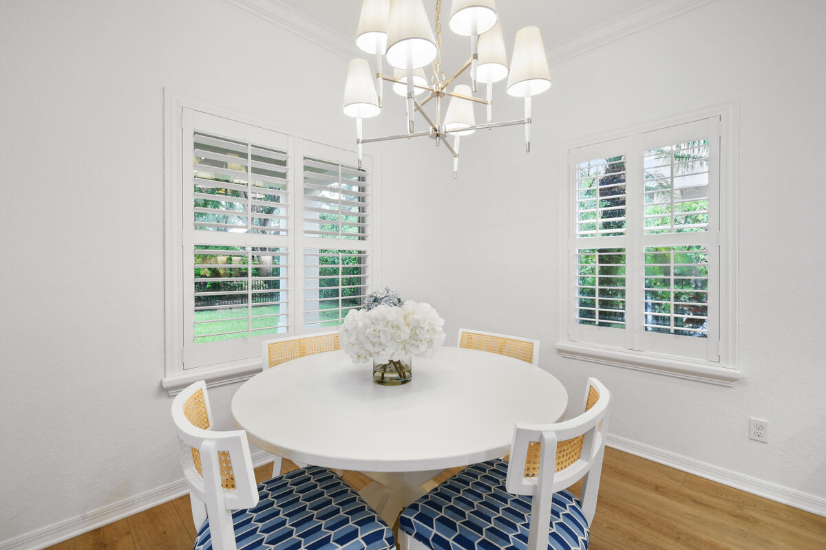 193 Porgee Rock Place Jupiter, FL 33458 - Photo 9 of 76 a view of a dining room with furniture and wooden floor