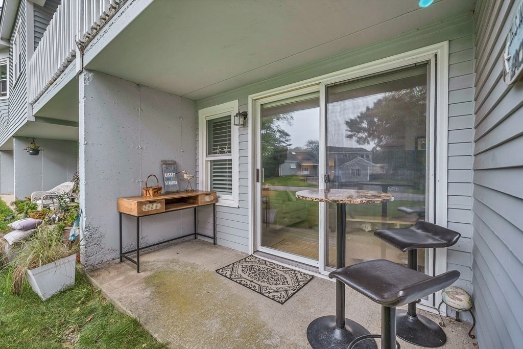 64 Esker Road, Unit 2 Hampton, NH 03842 - Photo 11 of 33 a outdoor living space with furniture and a potted plant