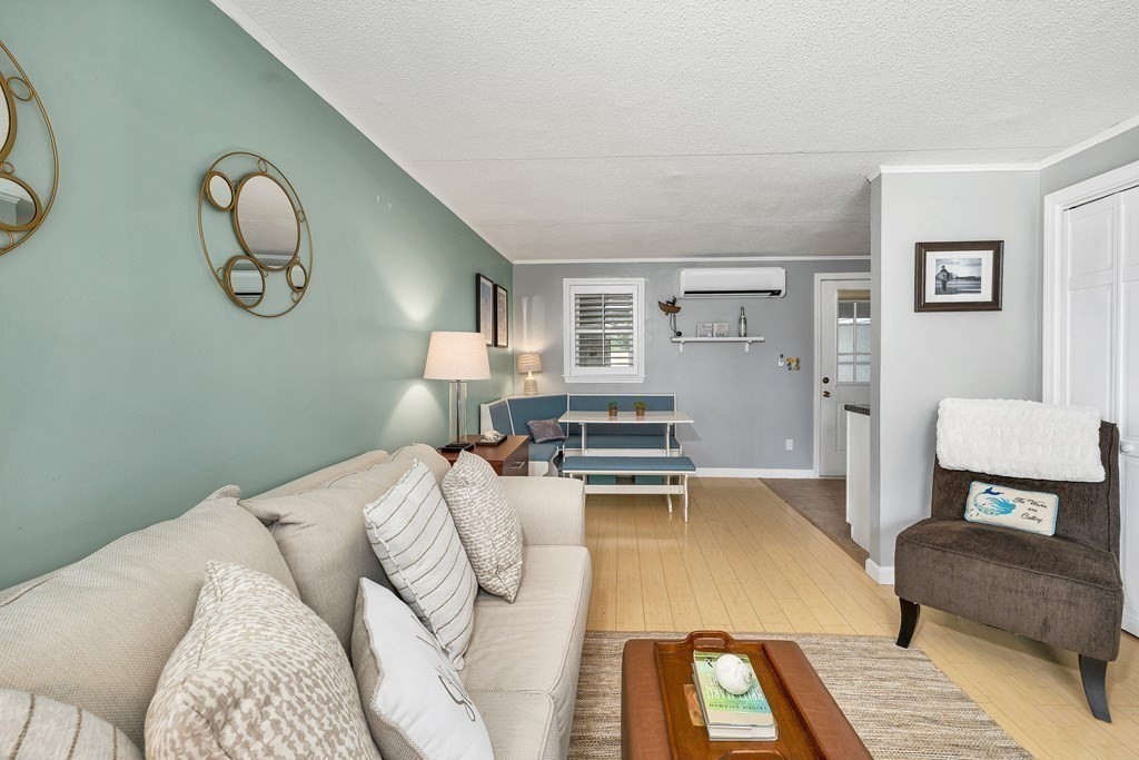64 Esker Road, Unit 2 Hampton, NH 03842 - Photo 13 of 33 a bedroom with a bed and dresser