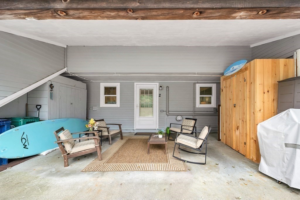 64 Esker Road, Unit 2 Hampton, NH 03842 - Photo 20 of 33 a living room with furniture and a window
