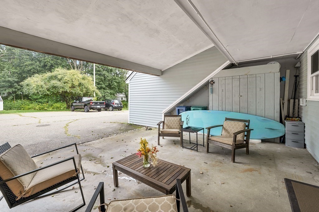 64 Esker Road, Unit 2 Hampton, NH 03842 - Photo 22 of 33 a backyard of a house with outdoor seating