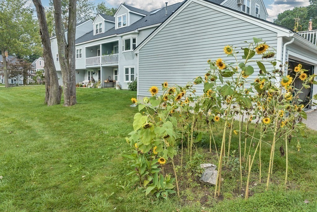 64 Esker Road, Unit 2 Hampton, NH 03842 - Photo 24 of 33 a view of an house with backyard and garden