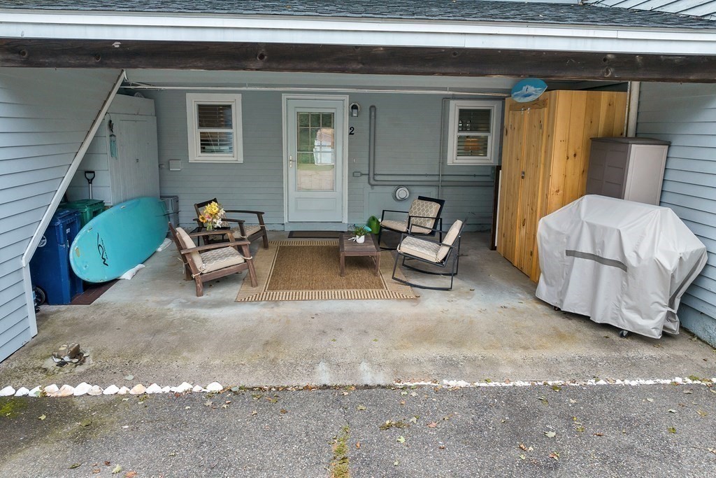 64 Esker Road, Unit 2 Hampton, NH 03842 - Photo 27 of 33 a backyard of a house with outdoor seating