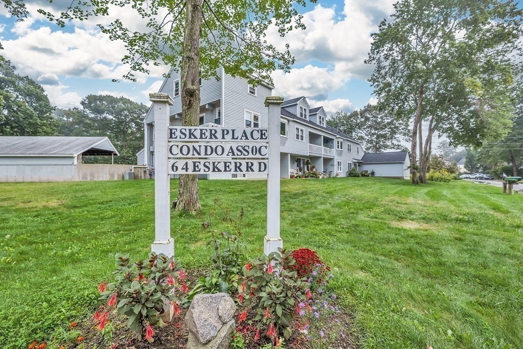 64 Esker Road, Unit 2 Hampton, NH 03842 - Photo 28 of 33 a view of a house with a yard and garden