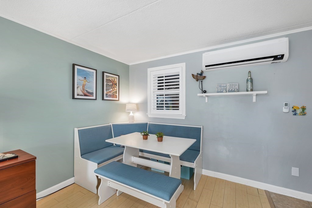 64 Esker Road, Unit 2 Hampton, NH 03842 - Photo 5 of 33 a living room with furniture and a window