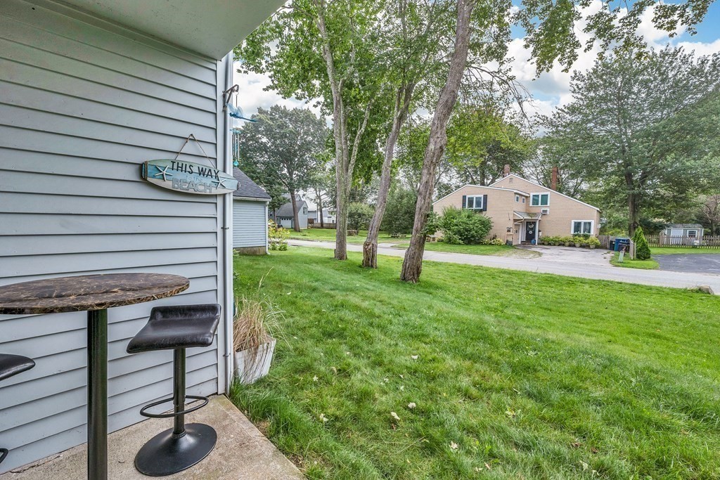 64 Esker Road, Unit 2 Hampton, NH 03842 - Photo 10 of 33 a view of house with backyard and a slide