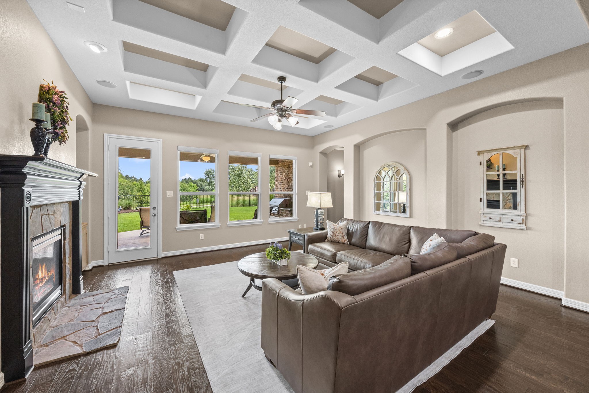 27642 Linden Ridge Lane Fulshear, TX 77441 - Photo 15 of 42 The architectural design of the coffered ceiling and elegant art niches combine to create a sophisticated focal point, adding depth, character, and timeless style to the Family Room.