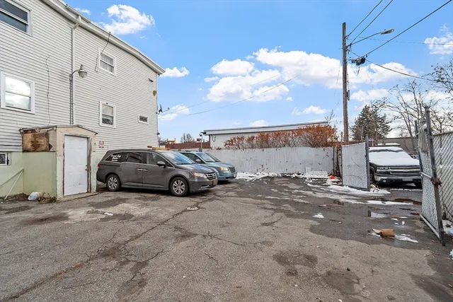 a view of a cars parked in front of a building