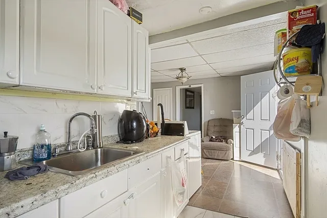 a kitchen with stainless steel appliances granite countertop a sink and cabinets