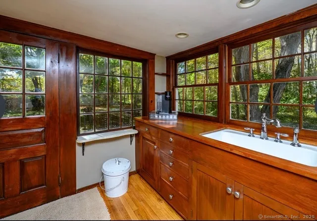 a view of livingroom with furniture wooden floor and windows