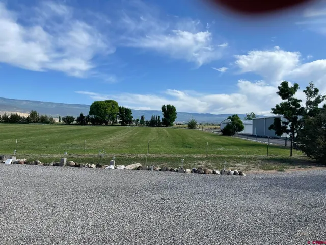 a view of a golf course with a yard