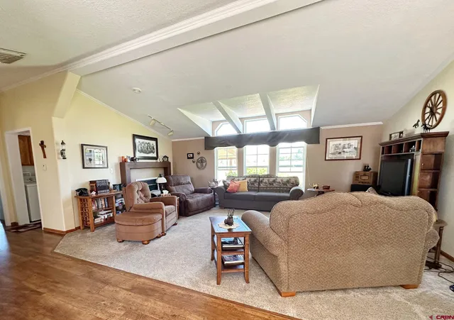 a bedroom with a large bed and furniture