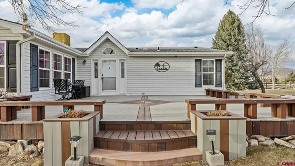a kitchen with refrigerator and cabinets