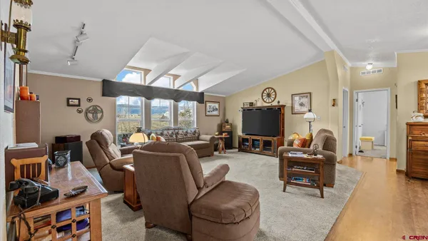 a bathroom with a double vanity sink toilet mirror and bathtub