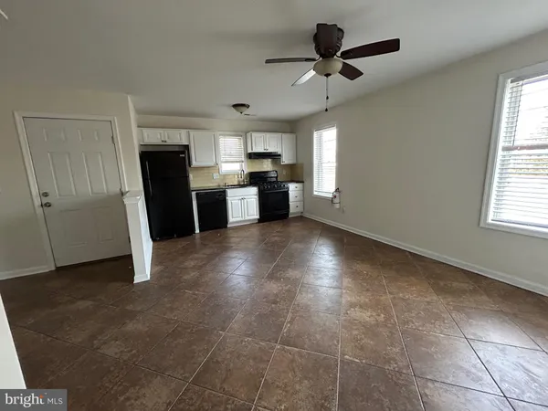 a view of a kitchen with a sink and a window