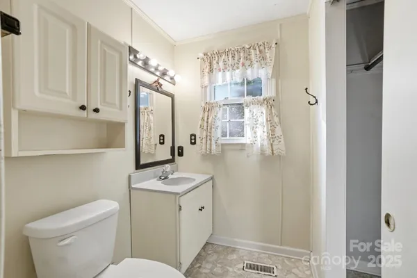 a bathroom with a toilet sink and shower