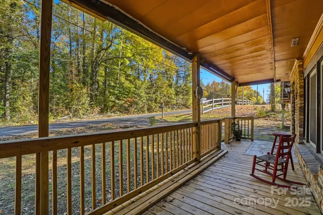 a view of a balcony with chairs