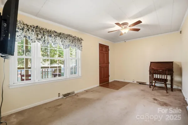 a view of an empty room with a window