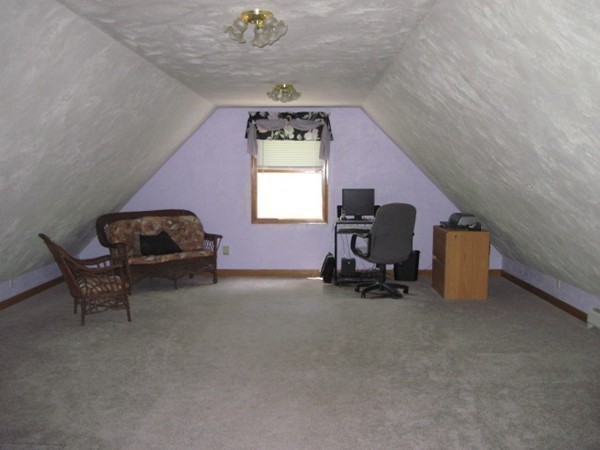 66 Old Poor Farm Road Ware, MA 01082 - Photo 19 of 26 a living room with furniture and a chair