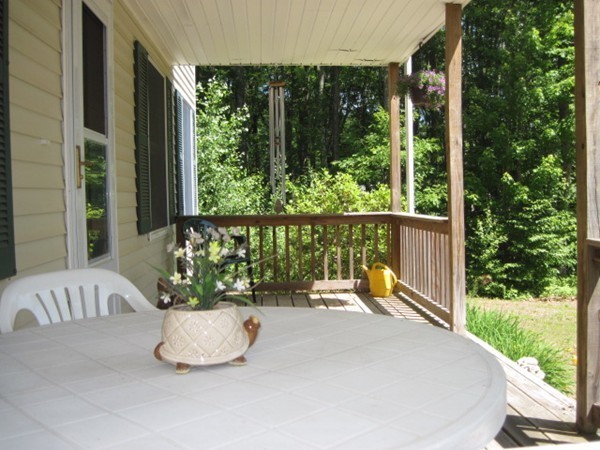 66 Old Poor Farm Road Ware, MA 01082 - Photo 3 of 26 a view of a porch with furniture and garden